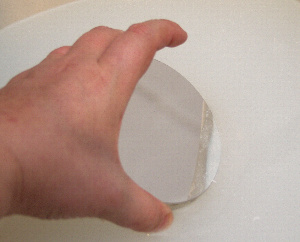 Placing the primary mirror into the soap flak mix with warm water