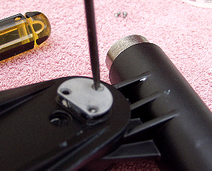 Fitting the retaining screws to the altitude bolt