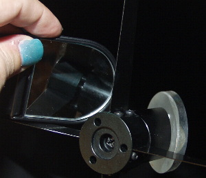 Checking the secondary mirror  tilt with a small mirror.