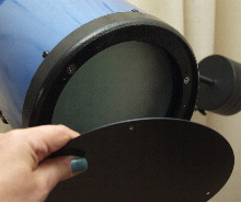 Removing the primary mirror cover.